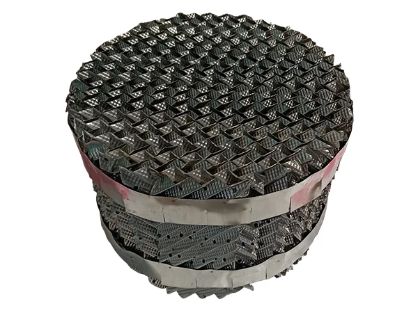 A round sheet metal structured packing with two clips and many small holes.